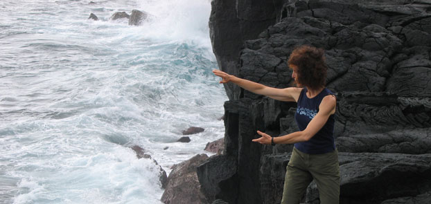 Elise doing Chi Kung by the sea, Puna